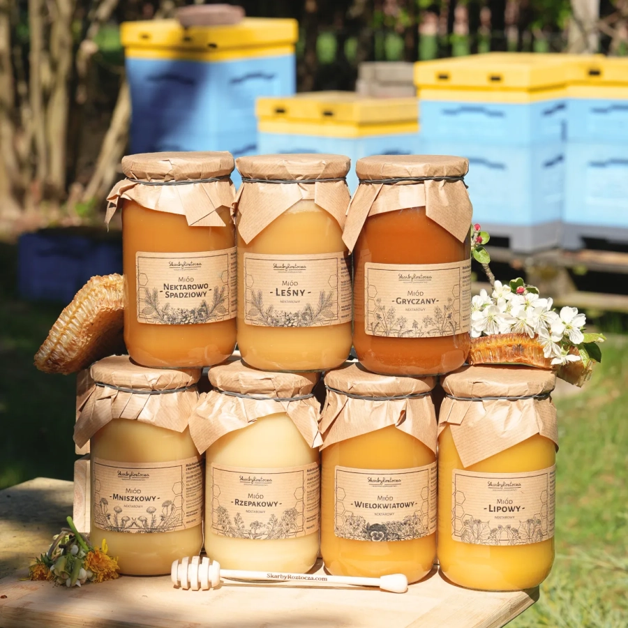 assorted honey set 7 large jars product beehives in background